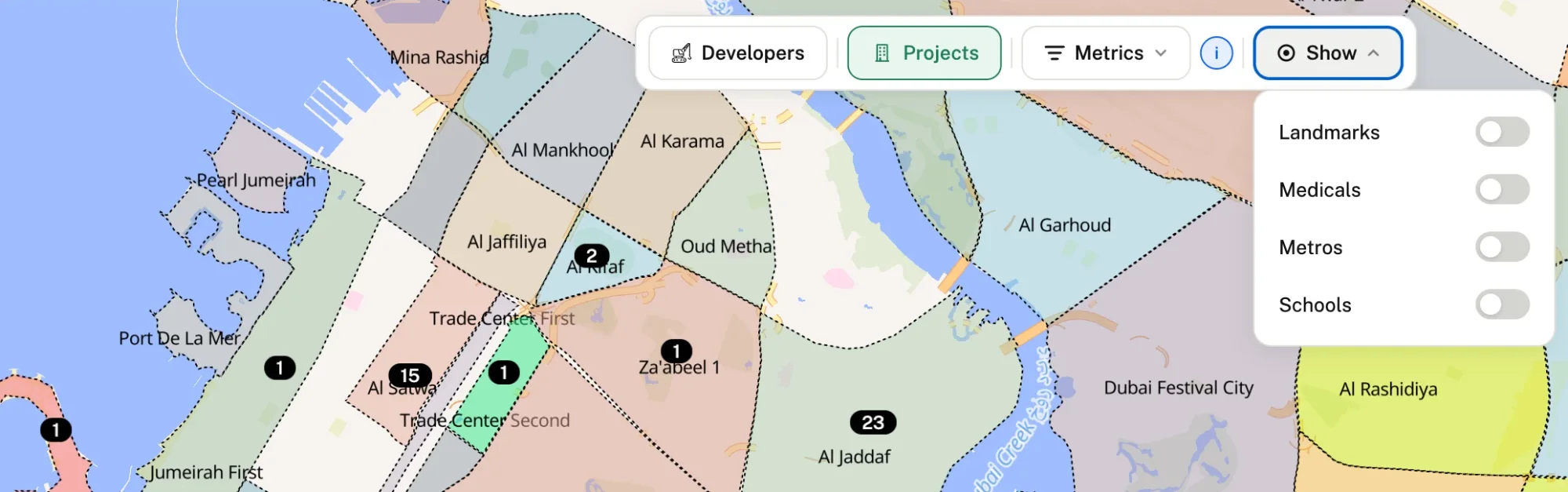 Map of central Dubai with the Show menu offering landmarks, medicals, metros and schools layers